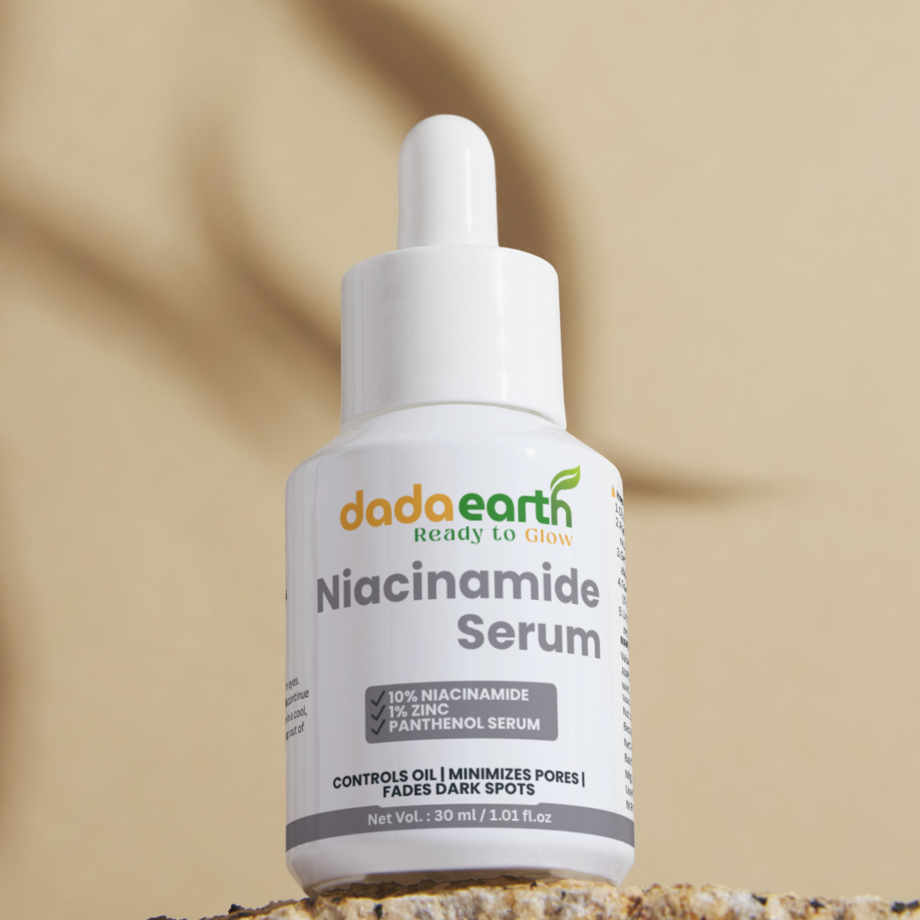 DadaEarth Niacinamide Serum bottle on a textured surface with a beige background