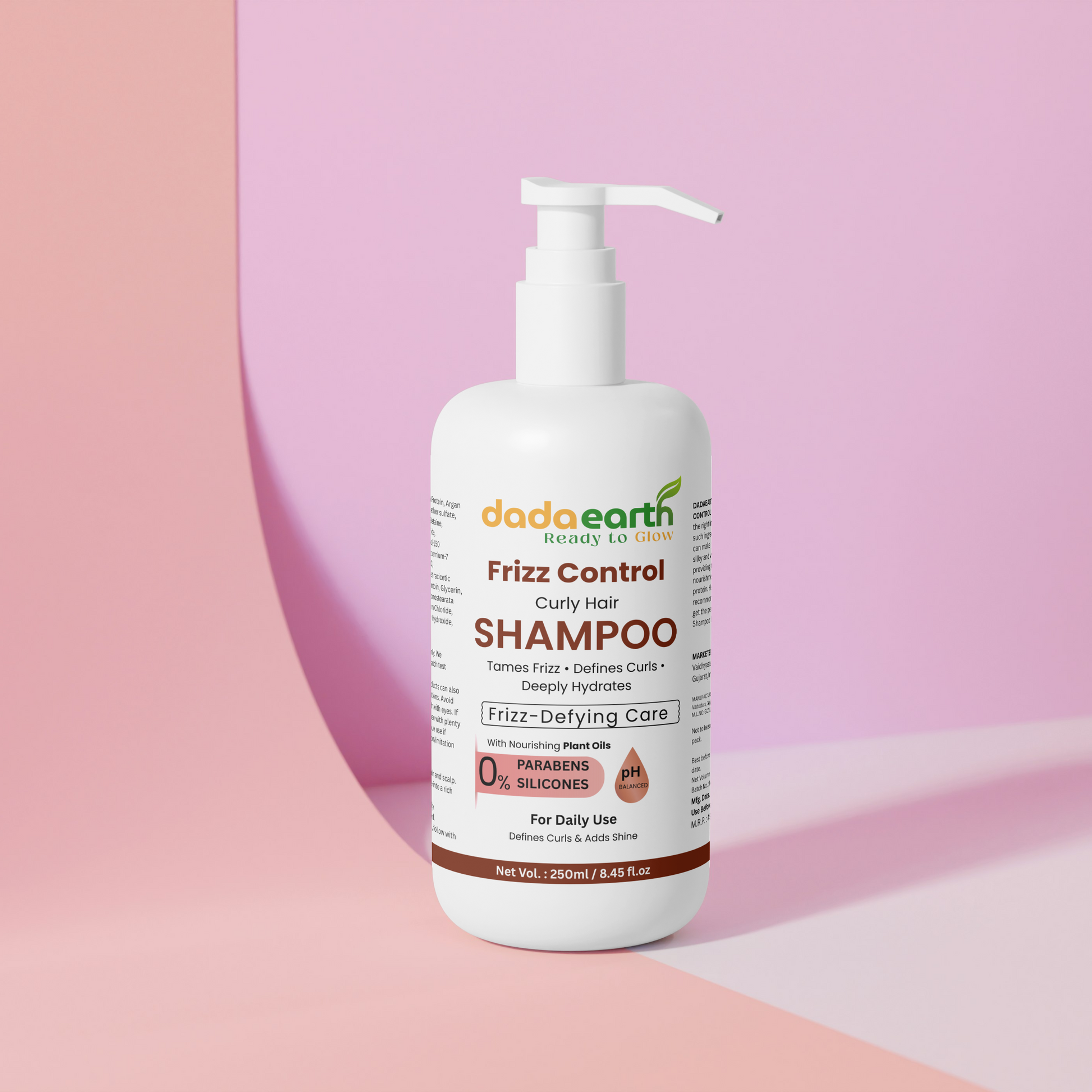 Dada Earth Frizz Control Shampoo bottle on a pink background